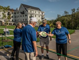 Couples at Grand Living playing pickleball